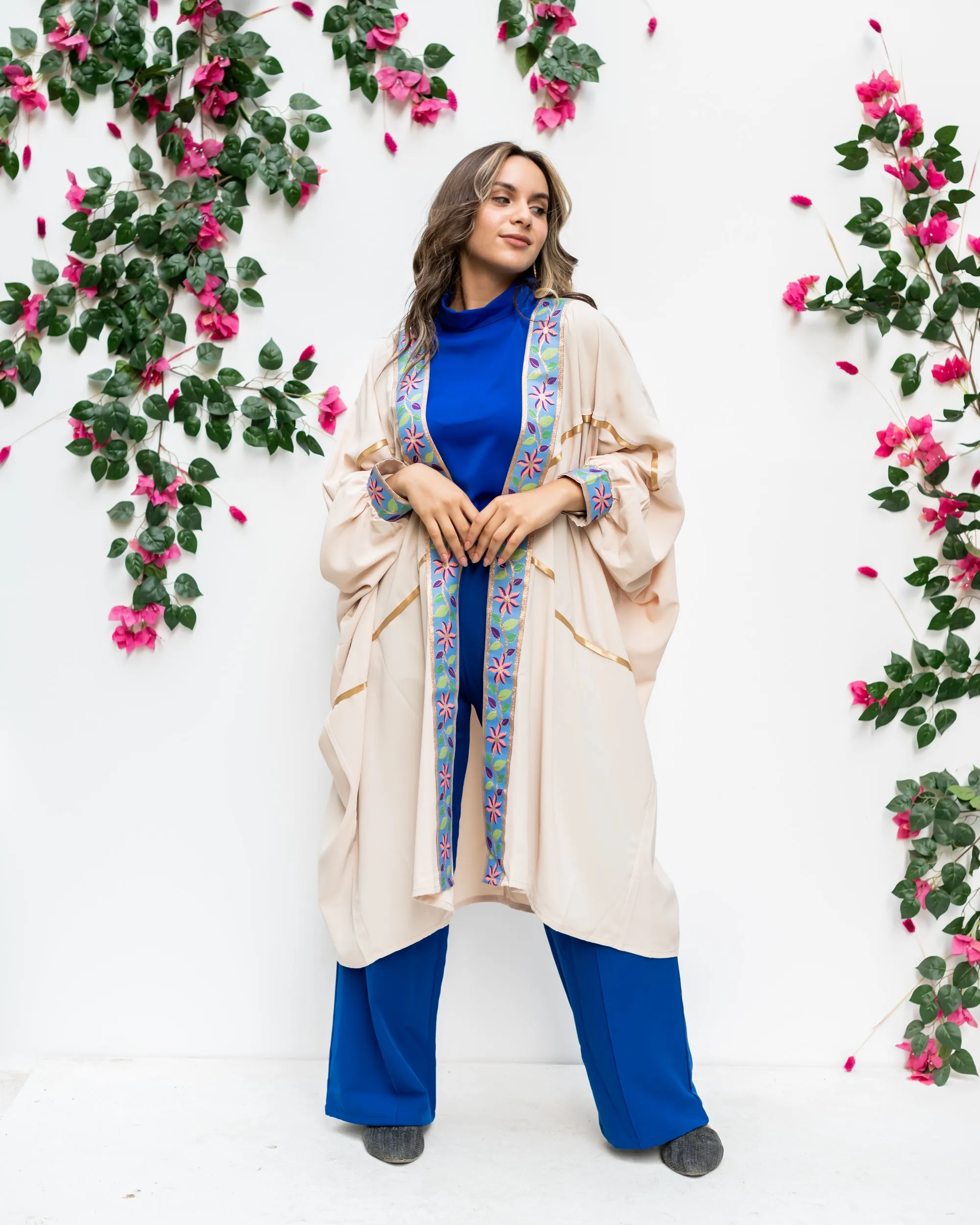 Beige open poncho with Indian tape