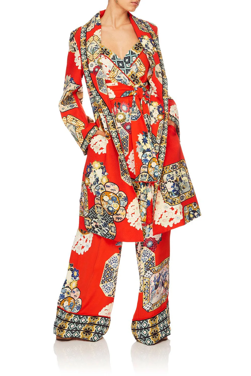 FLARED SLEEVE TRENCH FOUND IN TRANSLATION